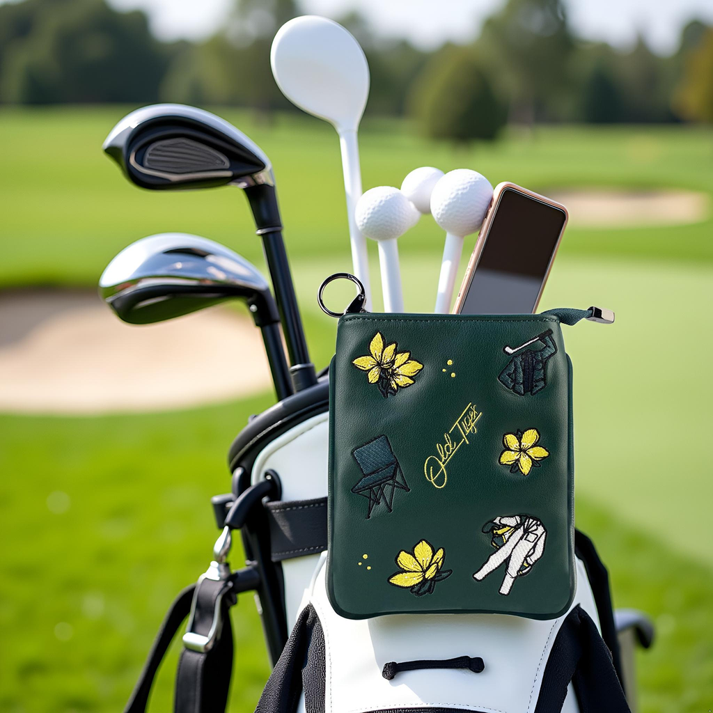 Golf pouch clipped to golf bag open showing balls and phone inside
