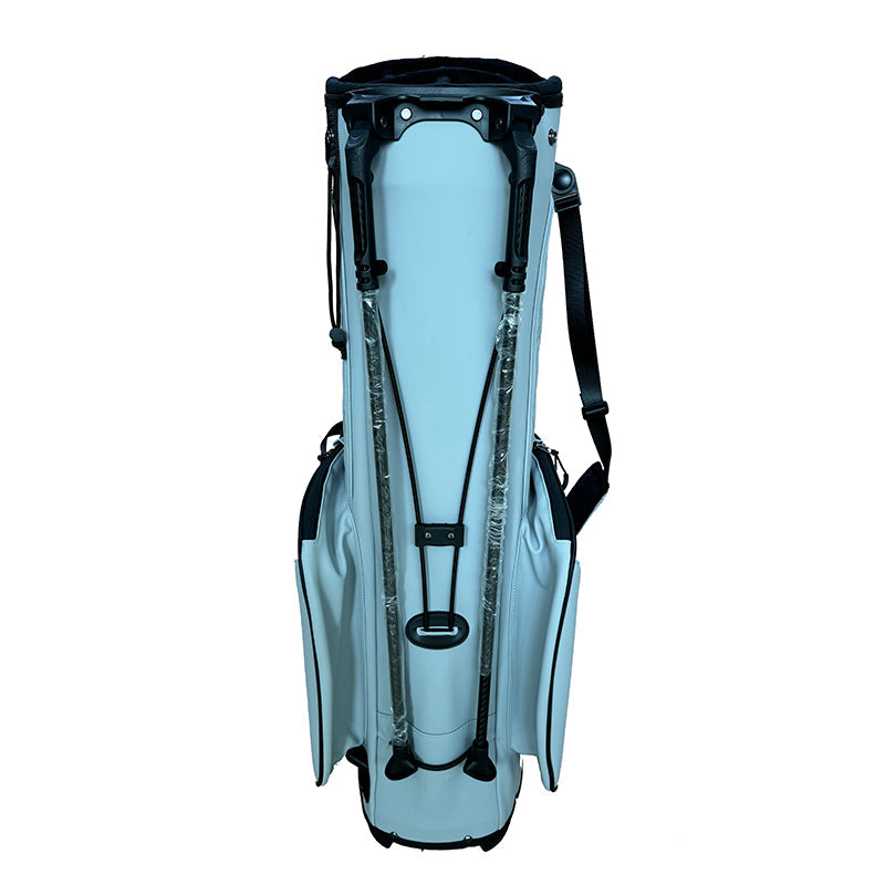 Ice blue quilted golf stand bag back view showing dual shoulder harness and back pocket