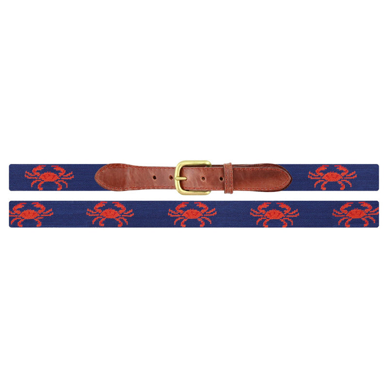 Navy blue red crab needlepoint belt coiled view showing repeating crab motif antique brass buckle