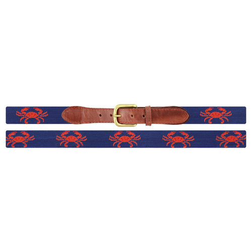 Navy blue red crab needlepoint belt coiled view showing repeating crab motif antique brass buckle