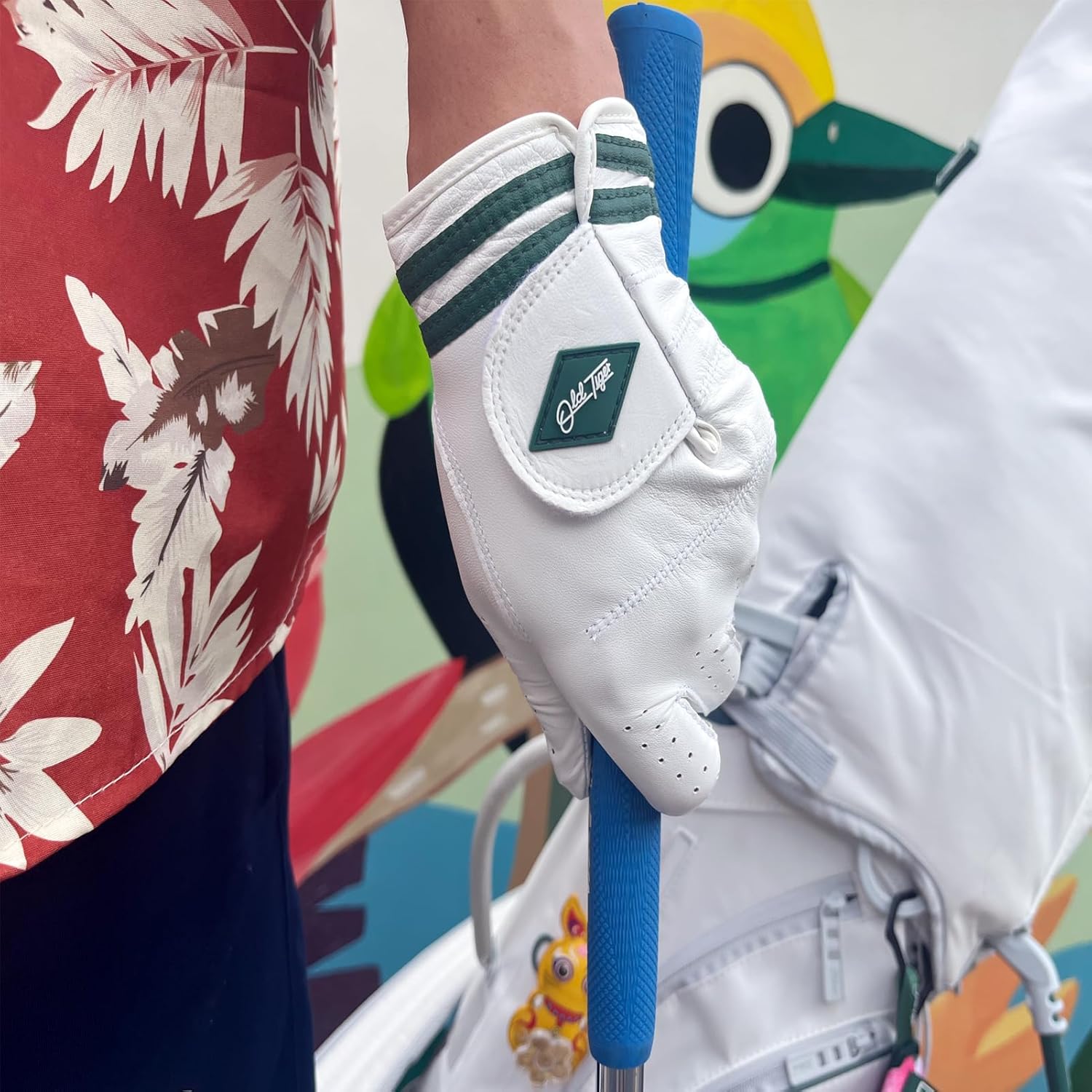 AAA Cabretta Leather Golf Glove with Green Stripe Wrist Band and Woven Logo Patch