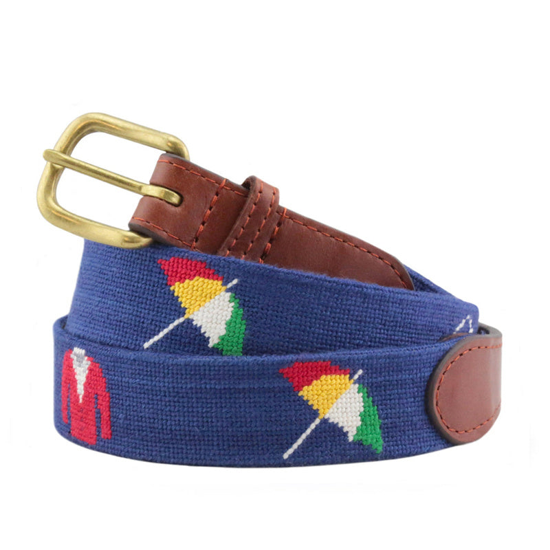Navy blue Arnold Palmer umbrella and red golf jacket needlepoint belt coiled brass buckle brown leather