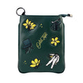 Close-up embroidery detail floral and golf motif on green PU leather