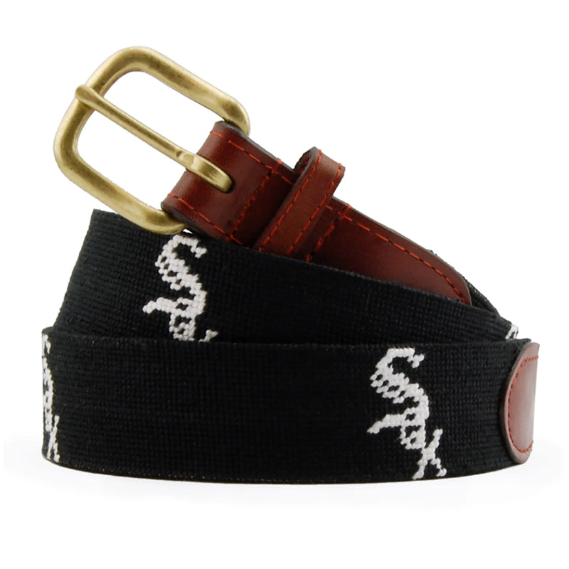 Black needlepoint belt with white Sox script logo and brass buckle coiled view