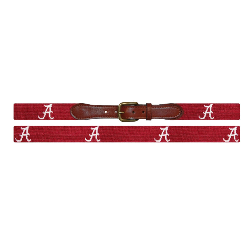 Light blue golf cart and 19th hole flag needlepoint belt flat lay with brass buckle brown leather