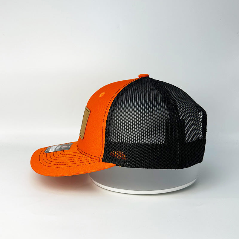 Custom blaze orange black trucker hat front and back pair view