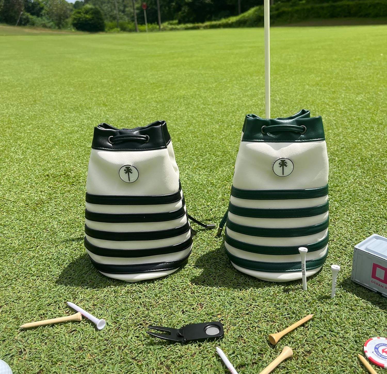 Striped bucket golf valuables pouch black and green stripe on golf course