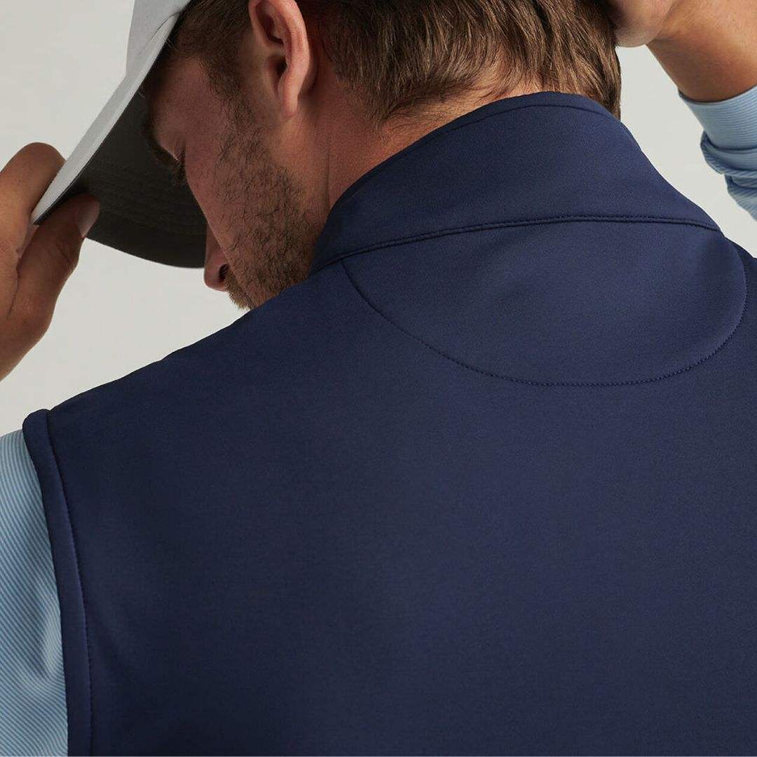 Navy quarter zip golf vest back yoke detail close-up